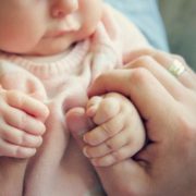 Baby in parent's hands